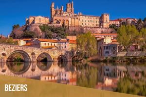 a view of a city with a bridge and a castle at Centre Historique - FREE Parking - Self Checkin - WIFI - LA CABANE - SLEEPNTRIPBEZIERS in Béziers