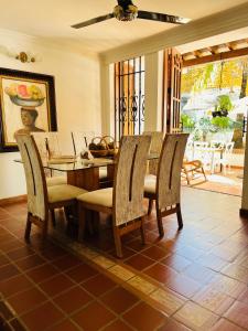 a dining room with a table and chairs at Casa Isabelita in Mompos