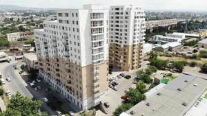 an aerial view of a tall building in a city at Tbilisi cozy apartment in Tbilisi City