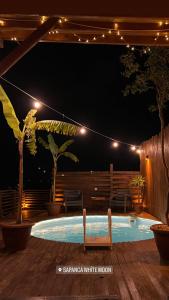 a swimming pool at night with lights on a deck at Sapanca White Moon in Sapanca