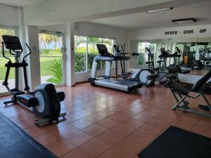 a gym with several treadmills and exercise bikes at Your Little Paradise - Juan Dolio in Juan Dolio