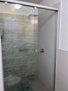 a shower with a glass door in a bathroom at Encantador apartamento 2 habitaciones/ Cochera / Gimnasio in Lima