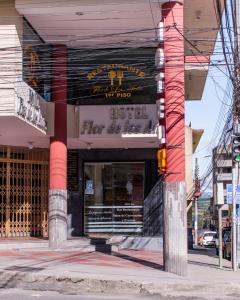 a store front with a sign for a fire department at HOTEL FLOR DE LOS ANDES in Tulcán