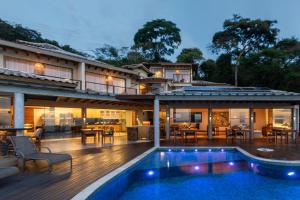 a house with a swimming pool and a patio at Casa Mirador Boutique Hotel in Búzios
