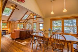 a dining room with a table and chairs at Lakeside Cottages on Toddy Pond in Orland