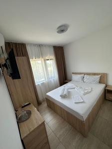 Postel nebo postele na pokoji v ubytování VILA TORETO