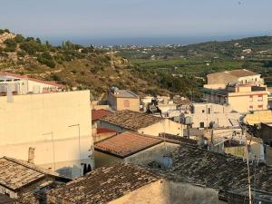 an aerial view of a town with buildings at Albemarooms in Noto