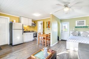 a living room with a bed and a kitchen at Fisherman's Retreat in Conch Key