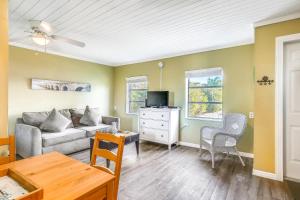 a living room with a couch and a table at Fisherman's Retreat in Conch Key