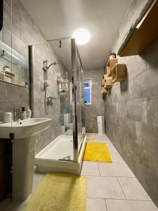 a bathroom with a shower and a sink at Cathedral View in Gloucester