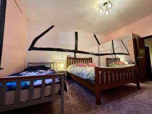 a bedroom with two beds in a room at Cathedral View in Gloucester