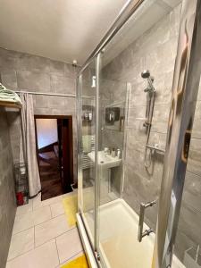 a bathroom with a shower and a sink at Cathedral View in Gloucester