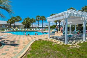 a pool at a resort with people playing in it at Maravilla 4409 in Destin