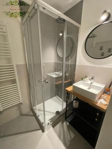 a bathroom with a shower and a sink at Monlochèl in Noci