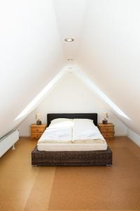 a bedroom with a bed in a attic at Haus im Felde Whg 5 in Fehmarn