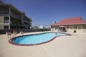 a swimming pool in the middle of a building at Sunset Harbour Villas 1-111 in Navarre