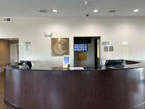 a large lobby with a large wooden reception counter at Comfort Suites Jackson-Cape Girardeau in Jackson +44 photos