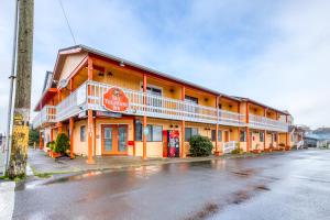 a building on the side of a street at Sea Treasures Inn Units #101-104, #114, & #115 in Rockaway Beach