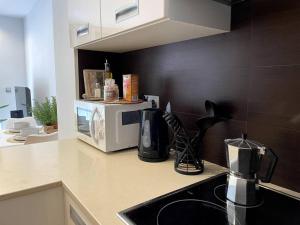 A kitchen or kitchenette at Taima Flats 2