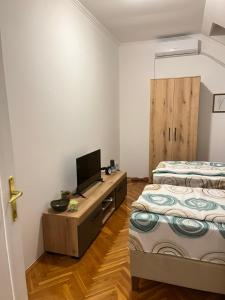 Postel nebo postele na pokoji v ubytování Guest Radic Apartment 2