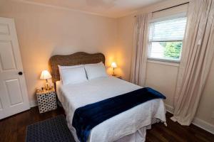 a bedroom with a large bed and a window at Country Cottage in The Hills in Augusta