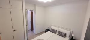 Postel nebo postele na pokoji v ubytování Bianca Apartment