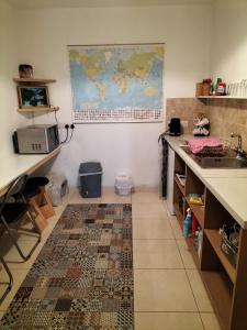 a kitchen with a map of the world on the wall at Peace and Tranquility in Ballymote