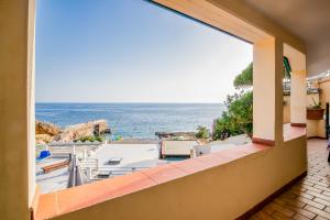 a view of the ocean from a balcony at Casa Stecchi in Capoliveri