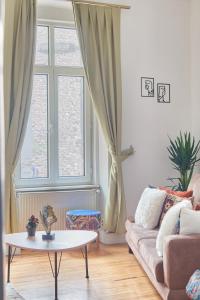 a living room with a couch and a table and a window at Your home heart of Istanbul in Istanbul