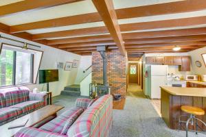 a living room with two couches and a fireplace at Crystal Mountain Cabin with Cozy Fireplace! in Thompsonville