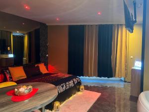 a bedroom with a bed and a table with a bowl on it at HomeSparadise in Besançon