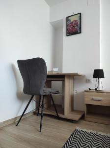a desk and a chair in a room at Apartment Deeranaei in Kraljevica
