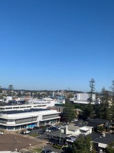 an overhead view of a city with a parking lot at Northpoint Apartments in Port Macquarie