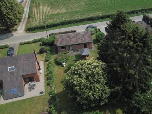 an aerial view of a house with a yard at Pleasant Holiday Home in Froidchapelle with Garden in Cerfontaine