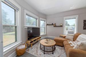 a living room with a couch and a table at Renovated 2 bed 2 bath Near Arena and Downtown in Spokane