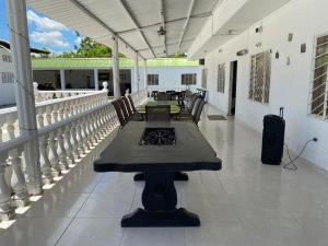 a patio with tables and chairs on a building at Finca Esperanza - Girardot - El Espinal in El Espinal