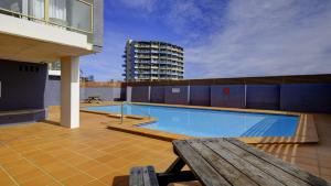 a swimming pool on the roof of a building at Ebbtide 6 in Forster