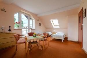 Ένα ή περισσότερα κρεβάτια σε δωμάτιο στο Willa Nadmorska