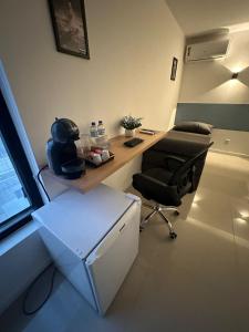 Area soggiorno di Audaar Tech Suítes - Aeroporto de Congonhas