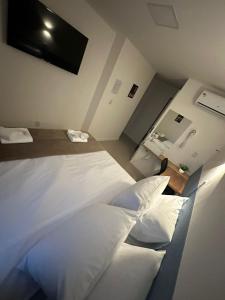 Letto o letti in una camera di Audaar Tech Suítes - Aeroporto de Congonhas