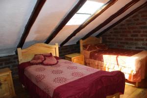 Ένα ή περισσότερα κρεβάτια σε δωμάτιο στο Rumipaxi Lodge