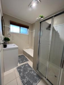 a bathroom with a shower and a sink at Fisher River Front in Griffin