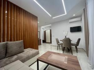 a living room with a couch and a table at Arbneshi Apartments in Ulcinj