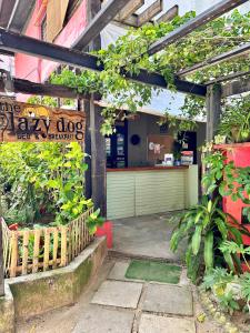 an entrance to a flower shop with plants at Lazy Dog Bed & Breakfast in Boracay