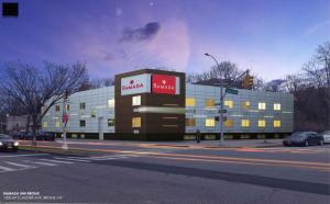 a large building with a marriott sign on it on a street at Ramada by Wyndham Bronx in Bronx