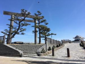 a set of stairs with trees on the beach at machiyado Kuwanajuku Honmachi 10 in Kuwana