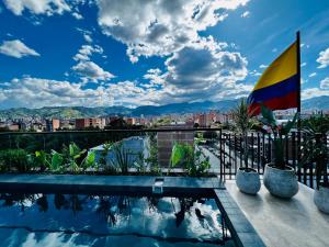 a view from the roof of a building with a swimming pool at Los Patios Cool Living in Medellín