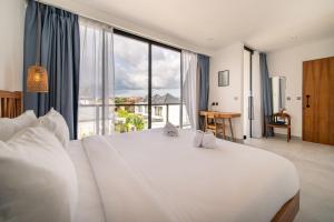 Postel nebo postele na pokoji v ubytování Villa Vantage Canggu + 17 fotografií