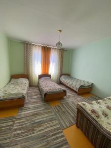 Postel nebo postele na pokoji v ubytování Guest House Regina