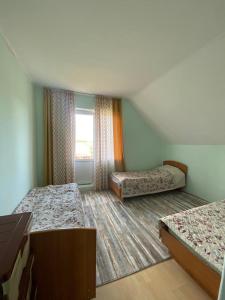 Postel nebo postele na pokoji v ubytování Guest House Regina + 24 fotografií